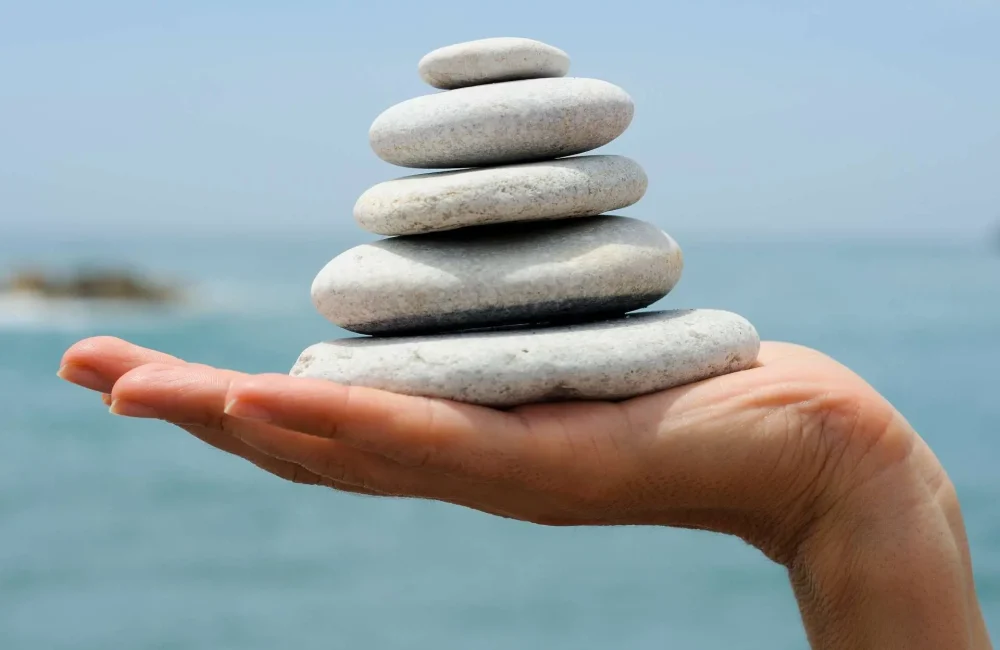 philosopy-gravel-pile-in-womans-hands-with-sea-background-D7TBKY8-low-res Our Mission